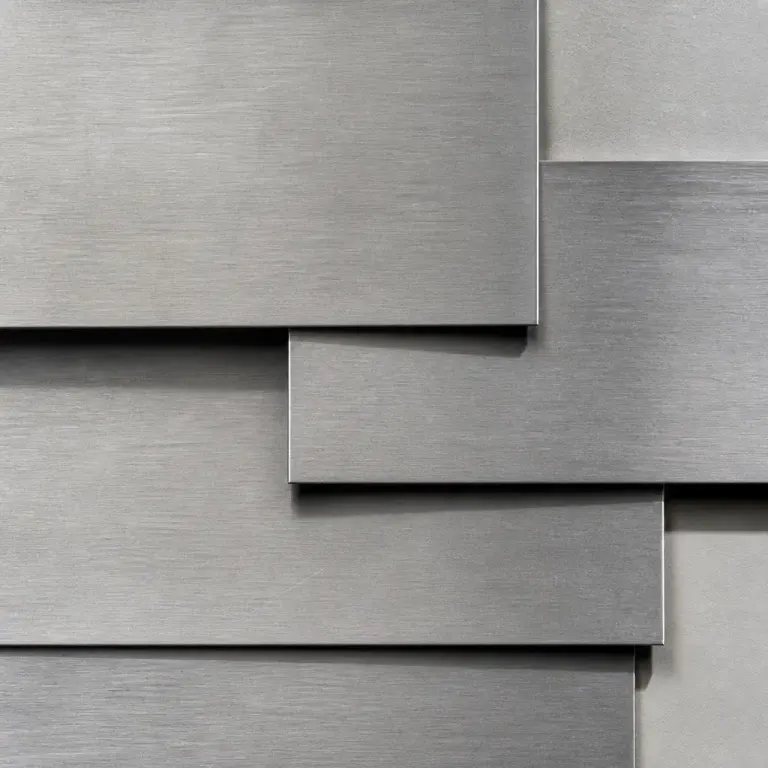 Overlapping brushed stainless-steel sheets with directional lines and hard edge shadows