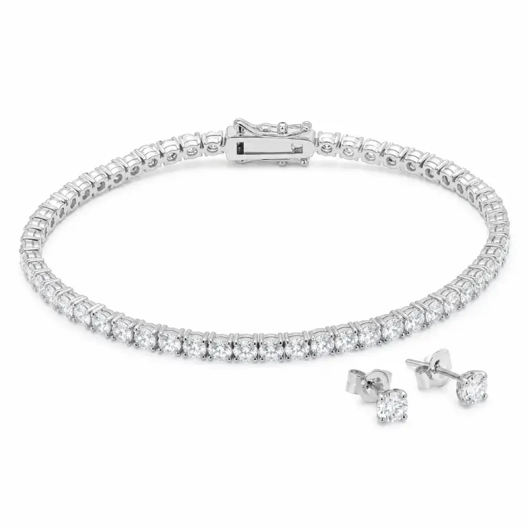 White-metal tennis bracelet with continuous clear gemstones and matching stud earrings in a bright ring-lit lightbox